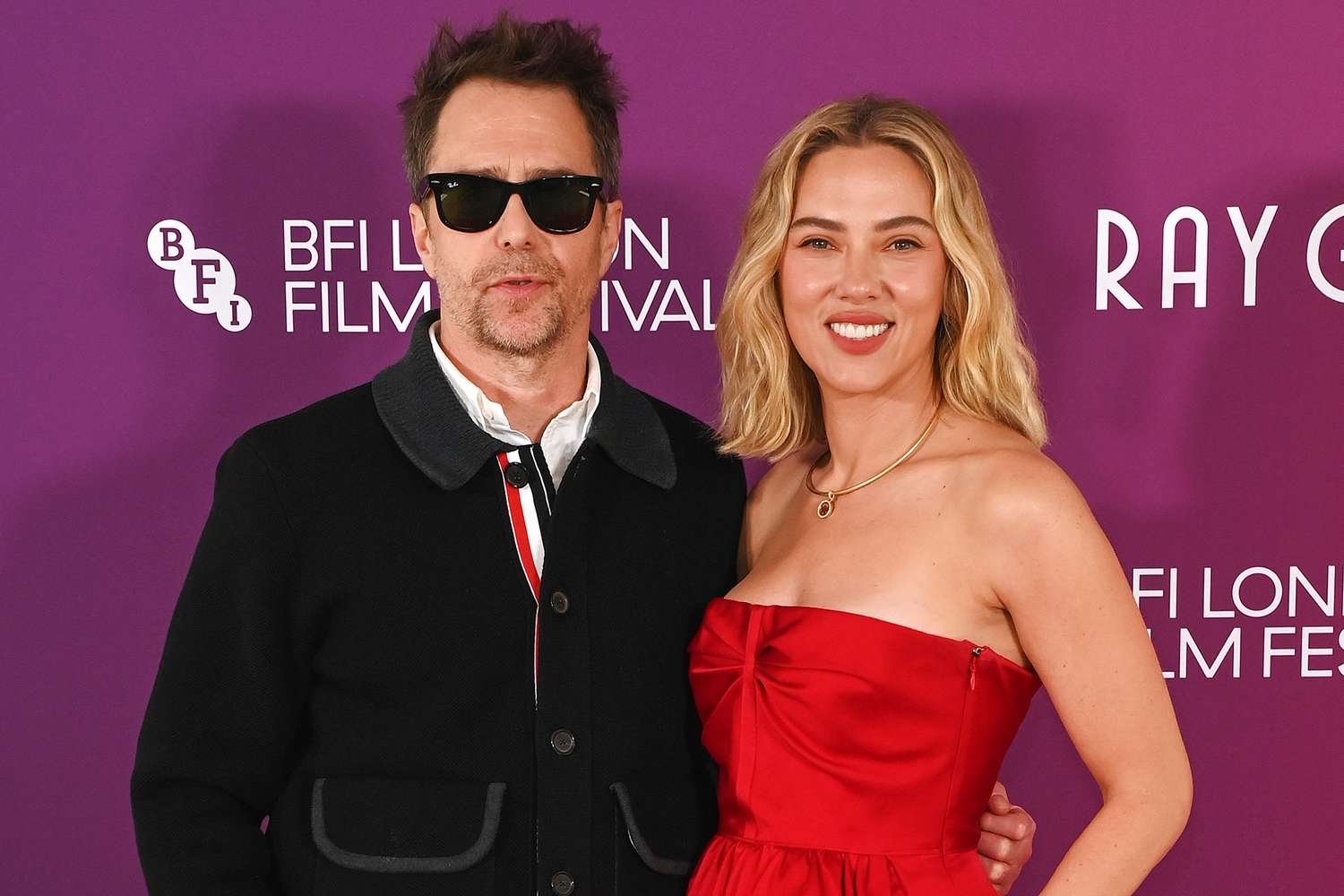 Sam Rockwell and Scarlett Johansson posing together at an event