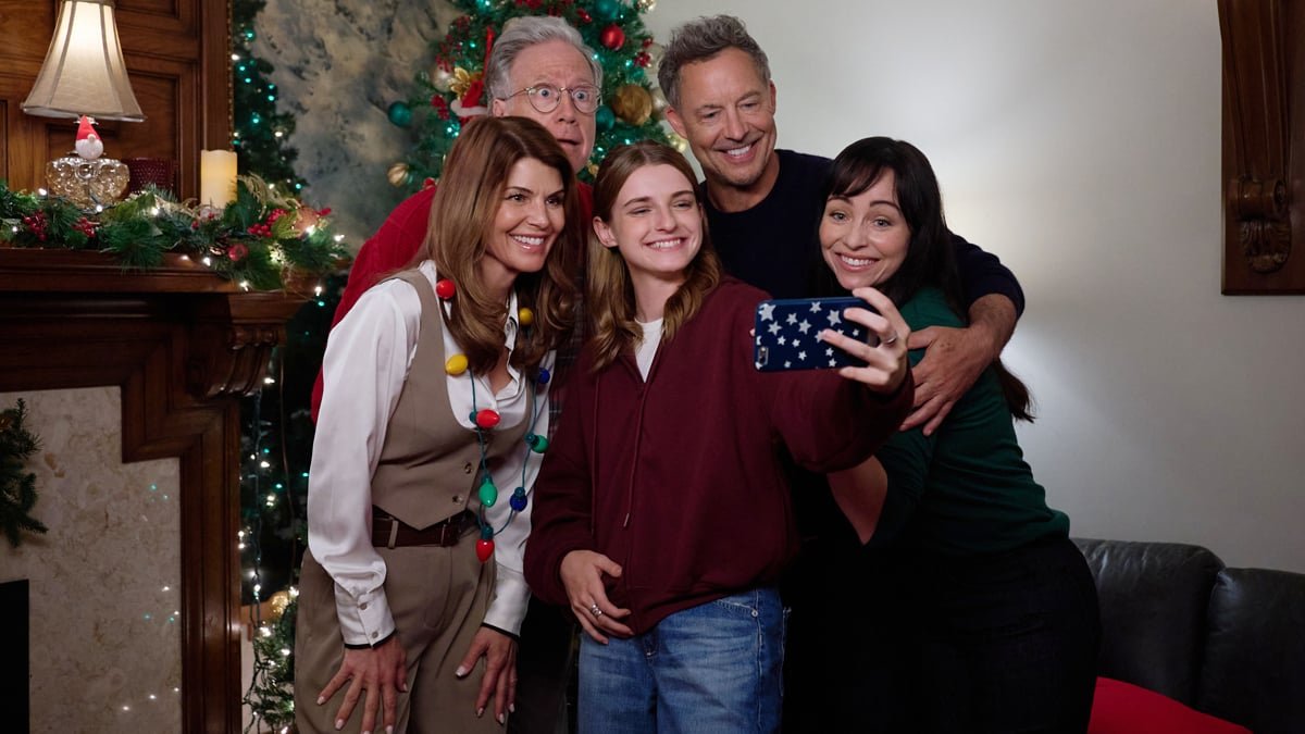 Lori Loughlin and Tom Cavanagh with the cast of What If Christmas pose for a holiday selfie together.